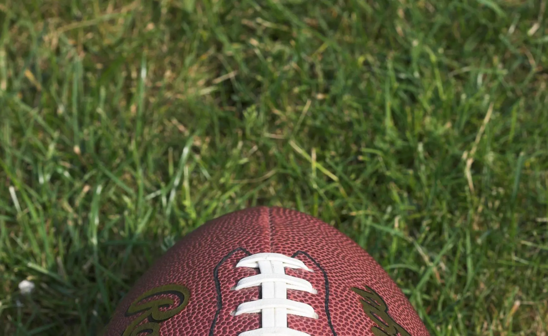 A close up of the laces on a football